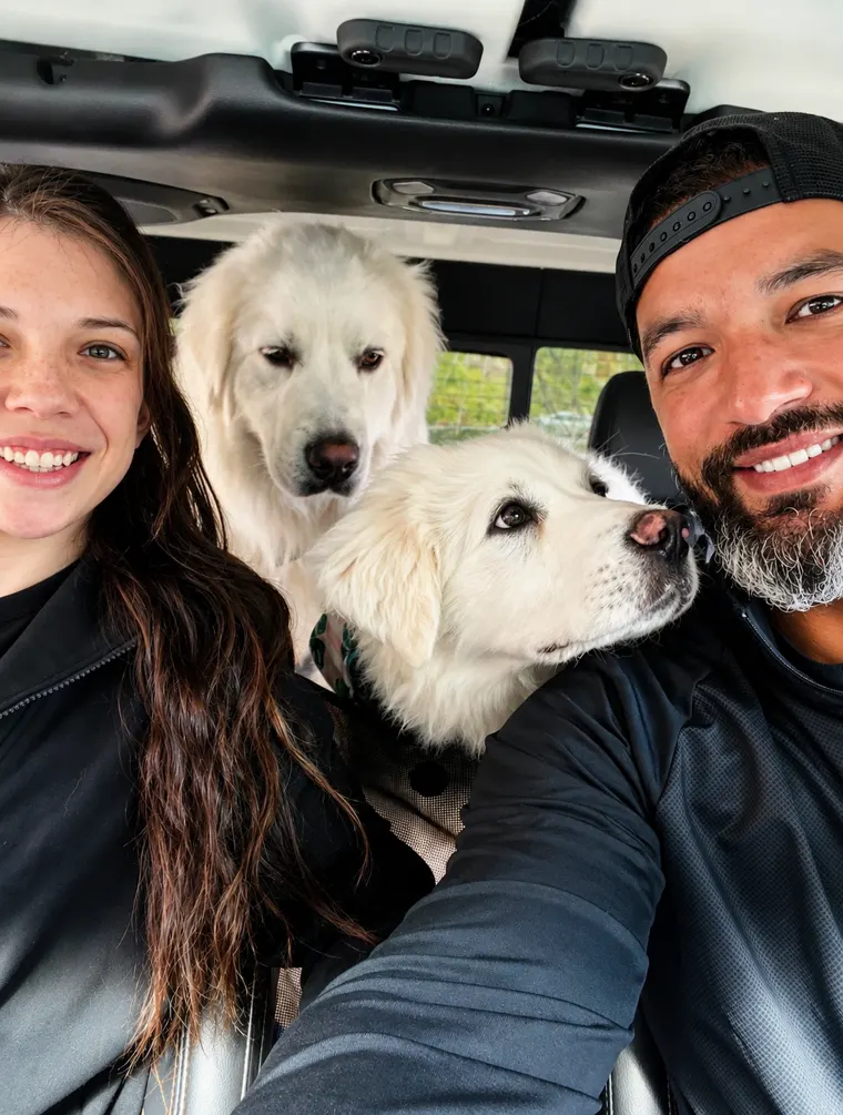 Jesse Daniels and his family with their two Great Pyrenees dogs